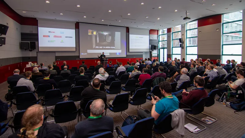 Vlad Iliushin from ELLIO speaking at FRESH IT Conference, happening in the OK Systems congress hall in Prague.