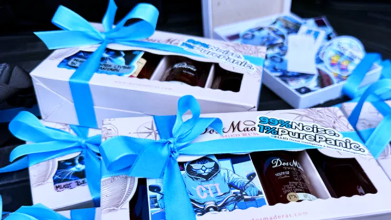 ELLIO Gift boxes with blue ribbons and cybersecurity stickers with Jack Hunter on motocycle